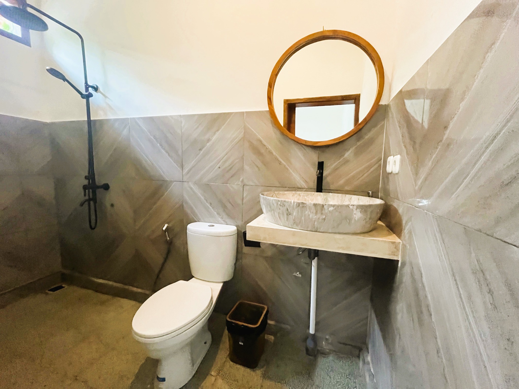 Enclosed bathroom with rain shower
