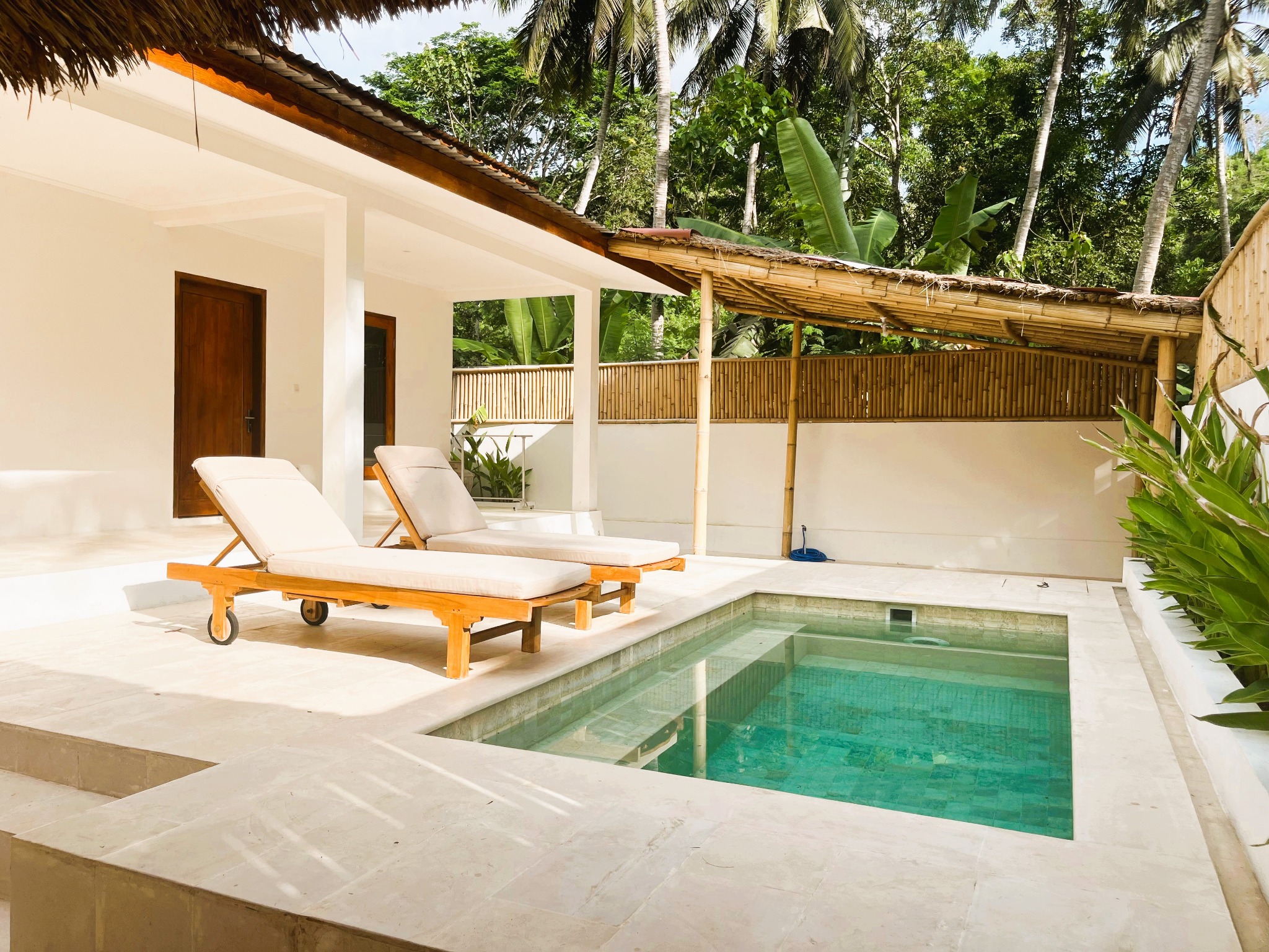 Pool, bamboo canopy and tropical garden